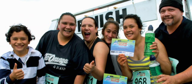 A group of teens giving thumbs up