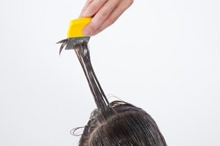 Using a fine tooth head lice comb