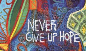 Mural with the words "Never give up home"