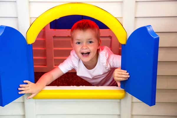 A boy in a playhouse