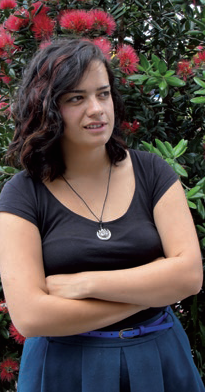 A teenager with her arms crossed