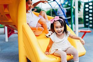 Children in a playground - on a slide
