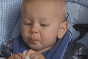Baby eating finger food