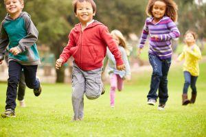 Multiethnic group of children running 